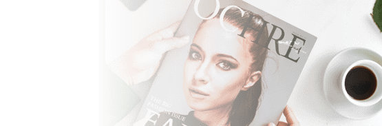 Hands holding a fashion magazine